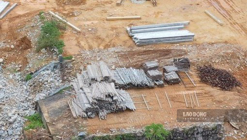 Raw materials for construction work are gathered outside the construction site. Photo: Dinh Dai