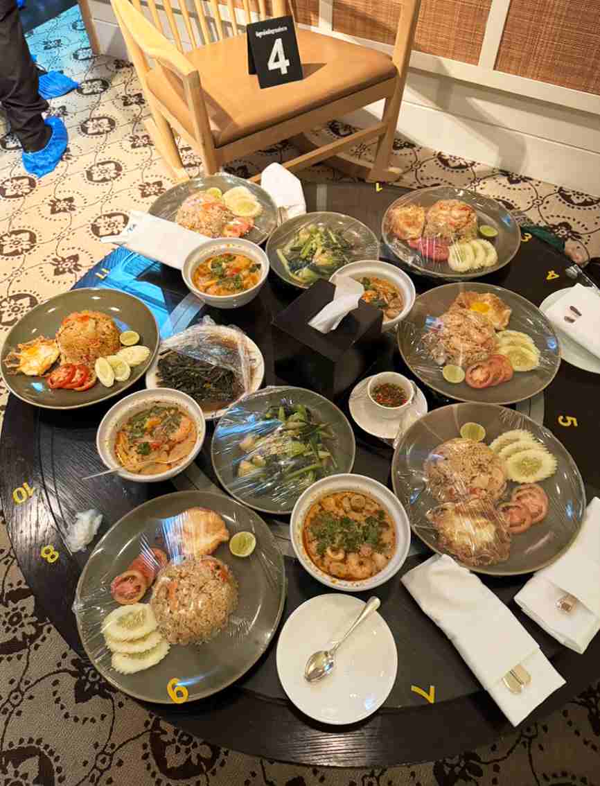 Food is still intact in the room of the Vietnamese victims who died at the Bangkok hotel, Thailand. Khaosod screenshot