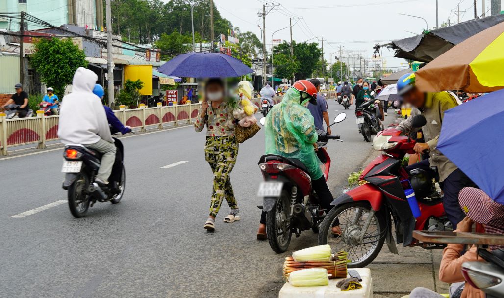 There are no more sidewalks, so many people have to walk on the street.