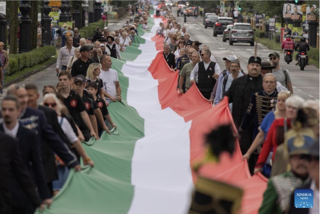 People parade with the 1,848 m long Hungarian flag to celebrate independence day June 2, 2024. Photo: Xinhua