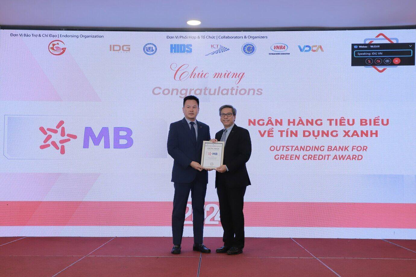 Mr. Ha Trong Khiem - MB's Deputy General Director (left) receives the 