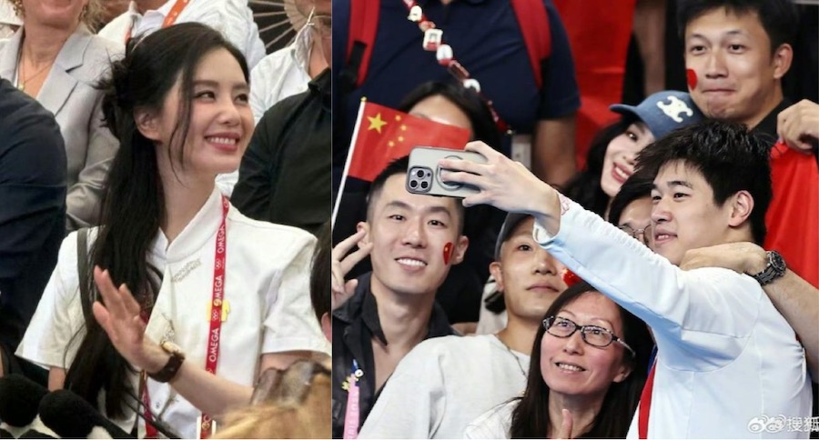 Liu Thi Thi took a photo with Phan Trien Nhac after winning the 2024 Olympic 100m freestyle gold medal. Photo: Xinhua