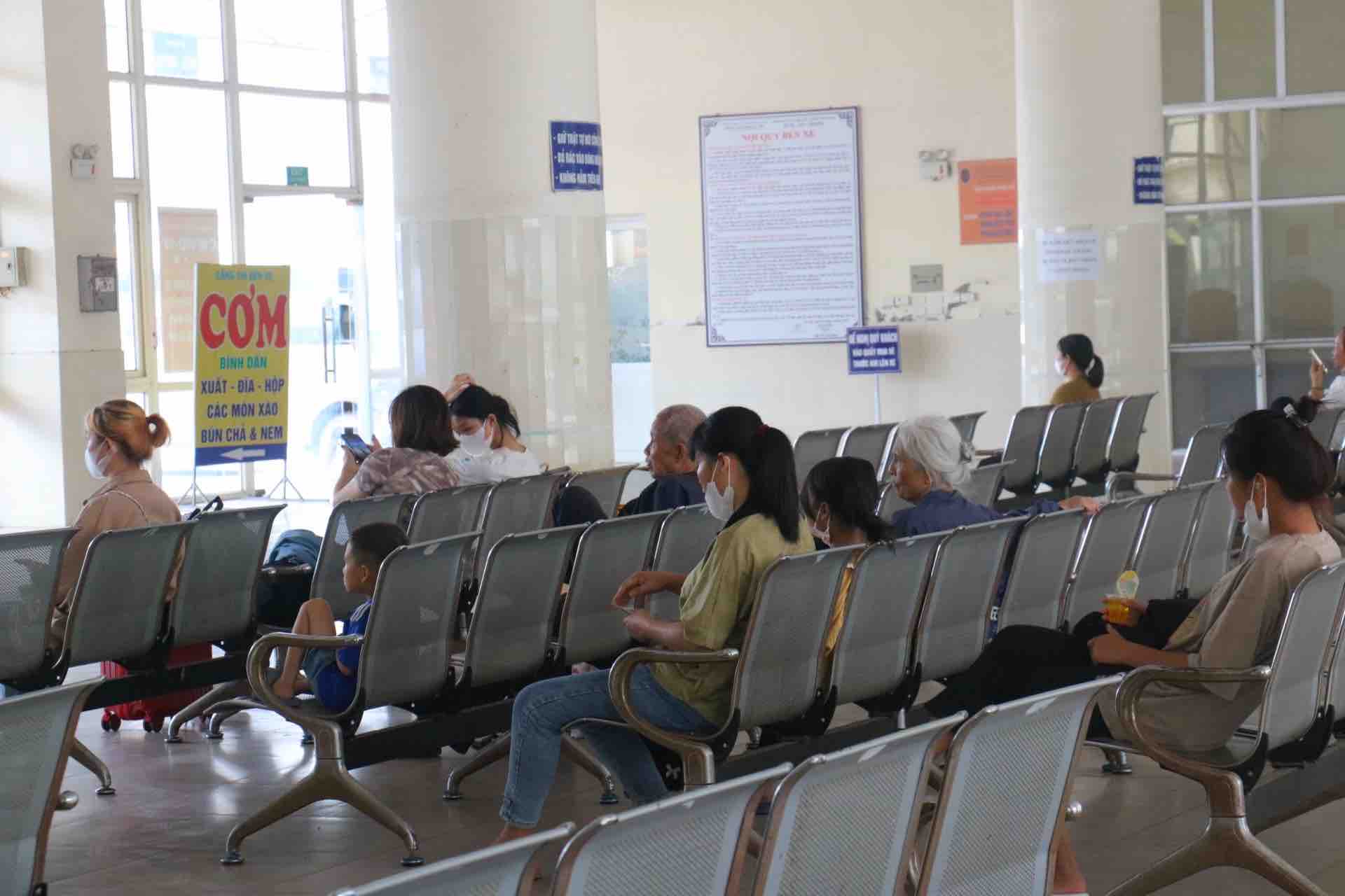 People wait to buy tickets at Giap Bus Station