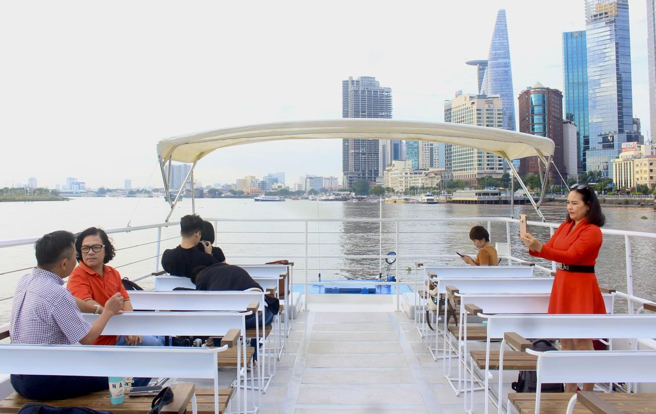 Guests explore the Saigon River on a double-decker river bus. Photo: Thanh Chan