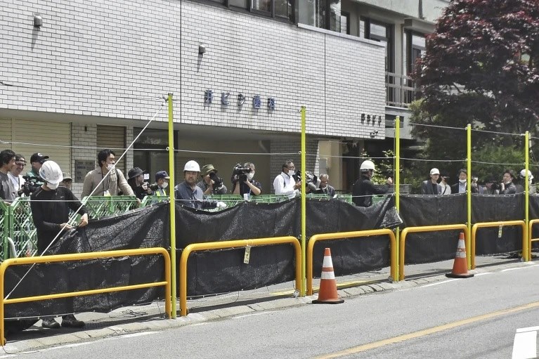 A giant black shield blocked views of Mount Fuji as tourists crowded into the area to take photos. Photo: Kyodo News