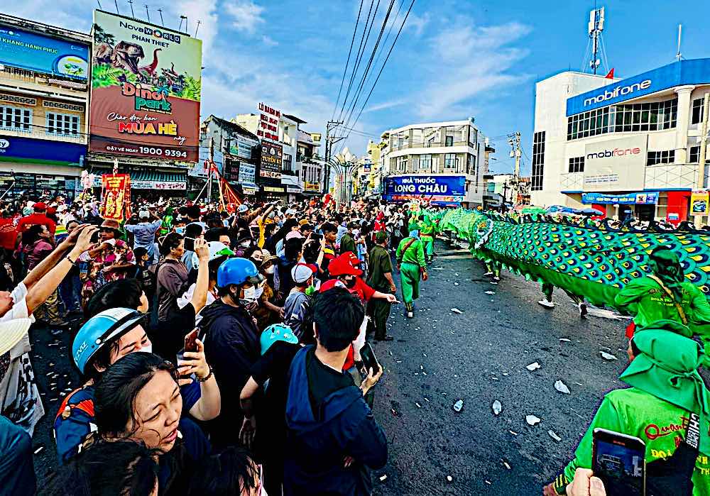 People stood and watched the parade pass by. Photo: Duy Tuan