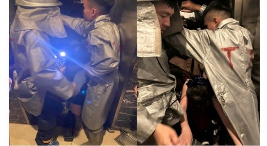 Công an giải cứu 9 người mắc kẹt trong thang máy ở Thanh Xuân. Ảnh: CA TP. Hà Nội