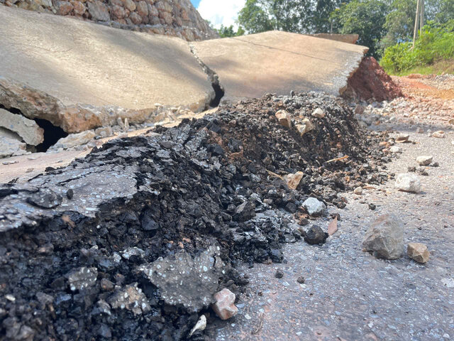 The cracked road surface is about 40m long and pushed up about 45cm. Photo: Dang Tinh