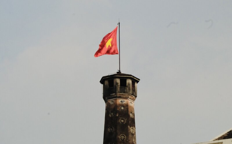 The red flag with yellow star flies at Hanoi Flag Tower.