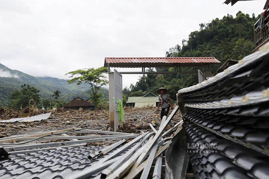 After more than a week of a terrible flash flood, the thick, red floodwaters receded, leaving behind thick layers of mud and soil covering the fields and gardens.