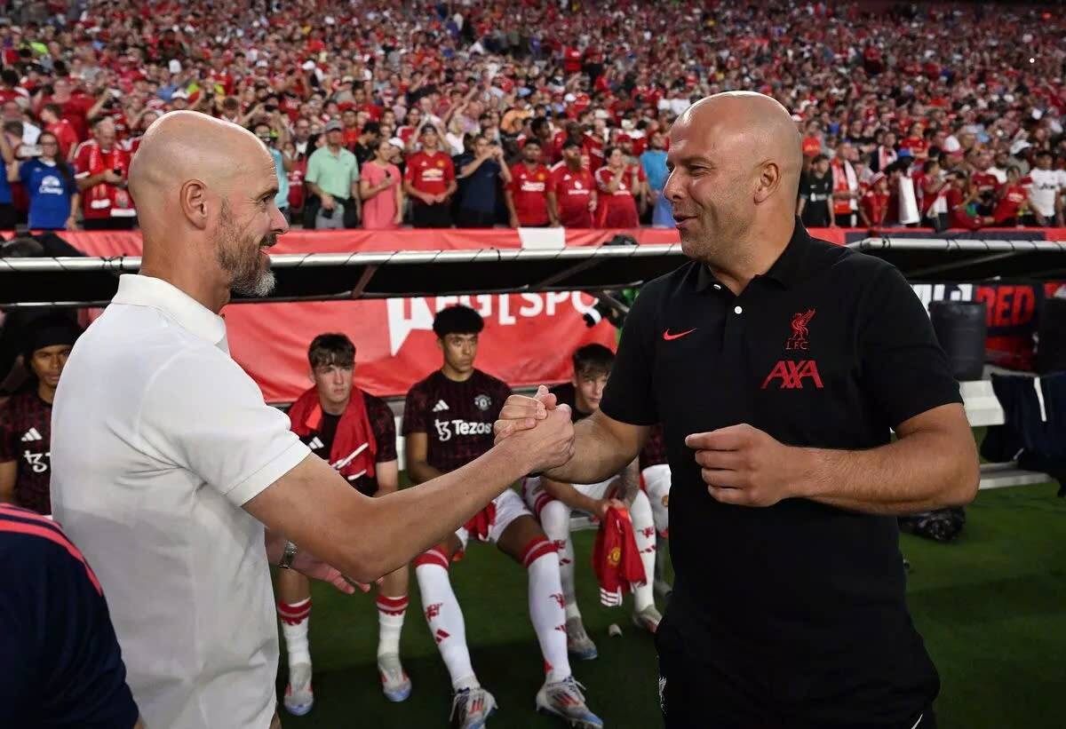 Ten Hag and Slot in a friendly earlier this month. Photo: LFC