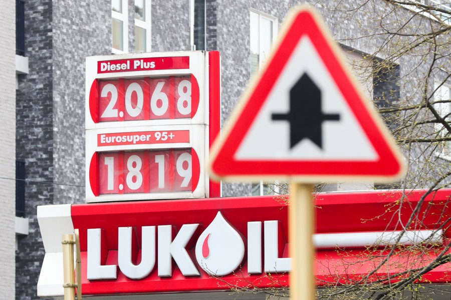 Lukoil's logo next to gasoline and diesel prices listed at a gas station in Brussels, Belgium. Illustration. Photo: Xinhua