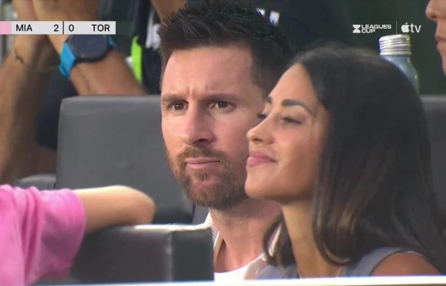 Messi sitting in the stands watching the match. Photo cut from video