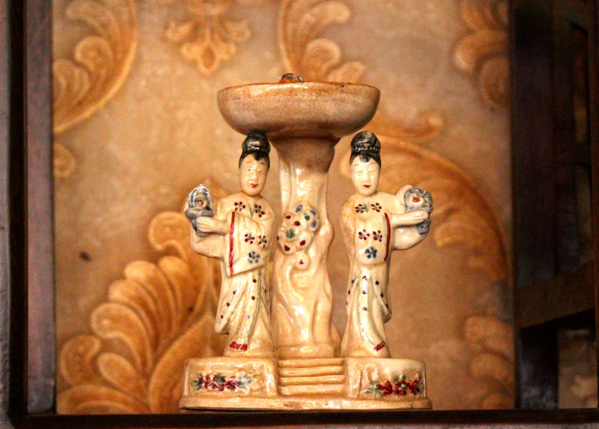 Close-up of an ancient oil lamp made from ceramic. Photo: Luc Tung