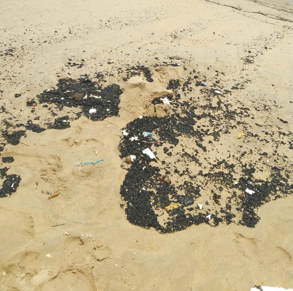 Authorities have yet to determine the origin of the oil patches that washed ashore. Photo: Nha Trang Bay Management Board