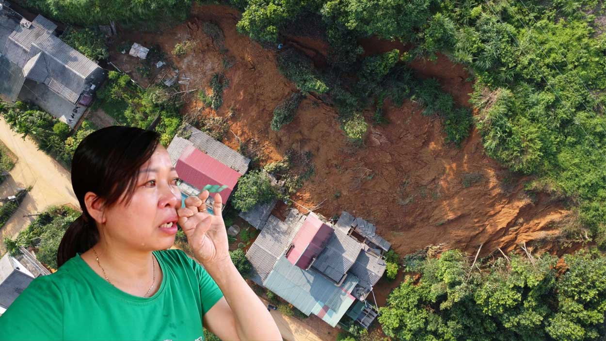 Chị Phạm Thị Hải (xã Vĩnh Bảo, TP Yên Bái) nhìn ngôi nhà tích góp gần 20 năm bị đất đá nuốt chửng. Ảnh: Trần Bùi