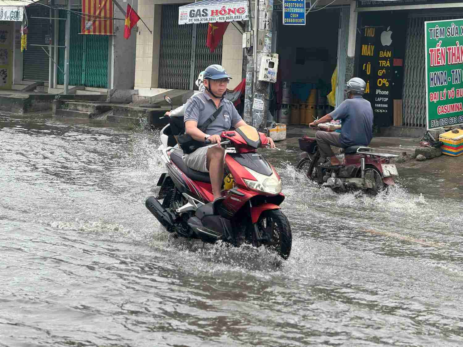 National Highway 50 through Binh Chanh District (HCMC) floods every time it rains. Photo: Thanh Vu