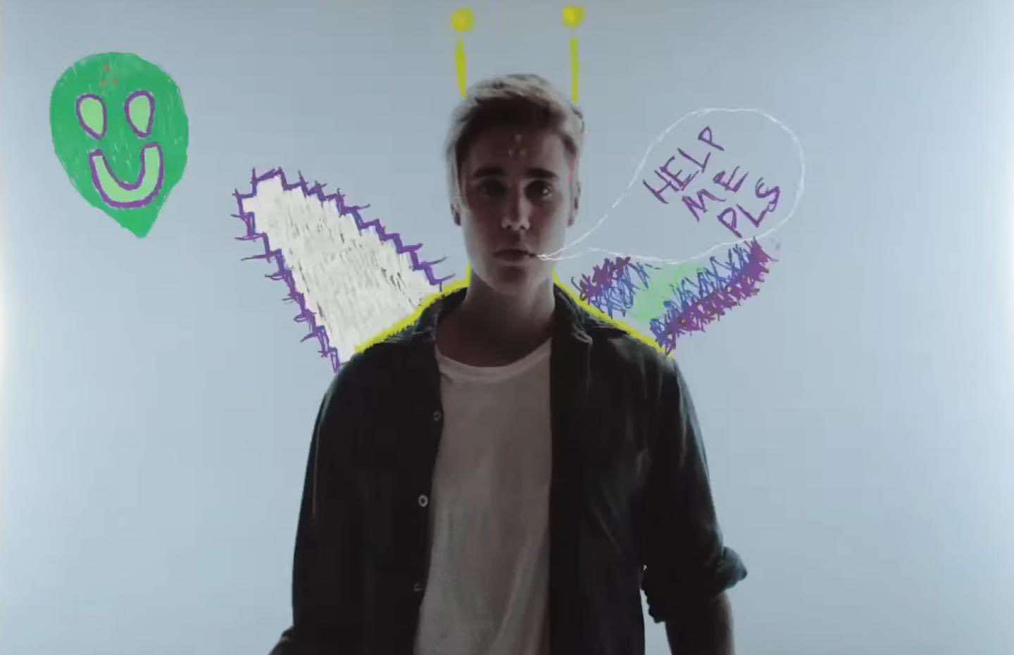 Justin Bieber signals for help. Photo: Cut from MV