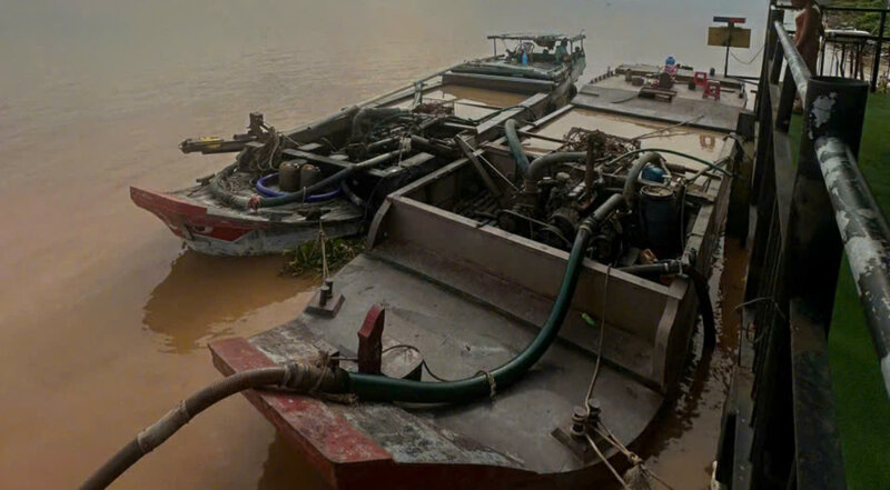 Caught red-handed two boats illegally dredging sand on the Co Chien River. Photo: Provided by the police.