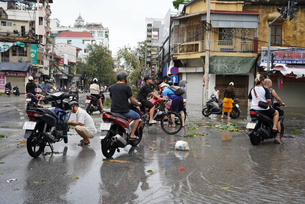 A series of cars stalled while passing through flooded roads.