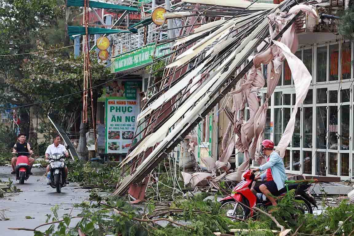 Many roads leading to Do Son beach are littered with corrugated iron roofs, iron poles, and fallen trees...