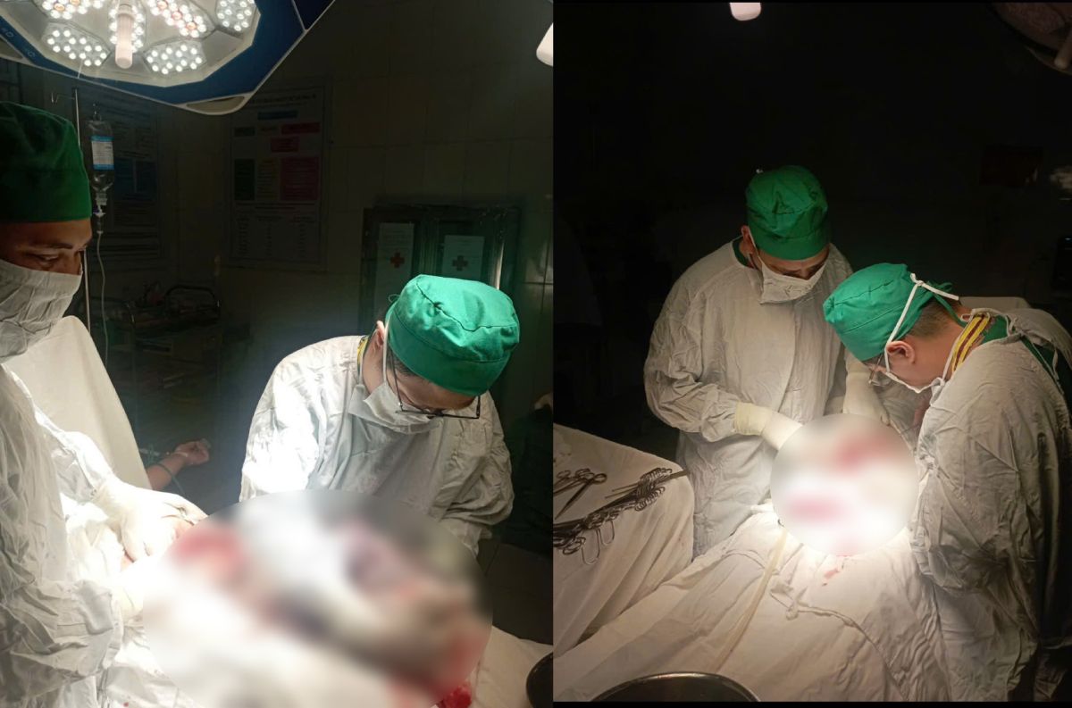 Dưới ánh sáng của máy phát điện khi bão số 3 đổ bộ các y bác sĩ TTYT huyện Xuân Trường (tỉnh Nam Định) đã phẫu thuật cấp cứu thành công thai phụ và thai nhi an toàn. Ảnh: bác sĩ cung cấp