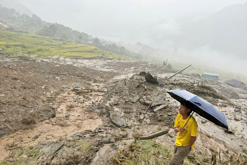 The landslide hit four households at the foot of the hill. Photo: Dinh Dai