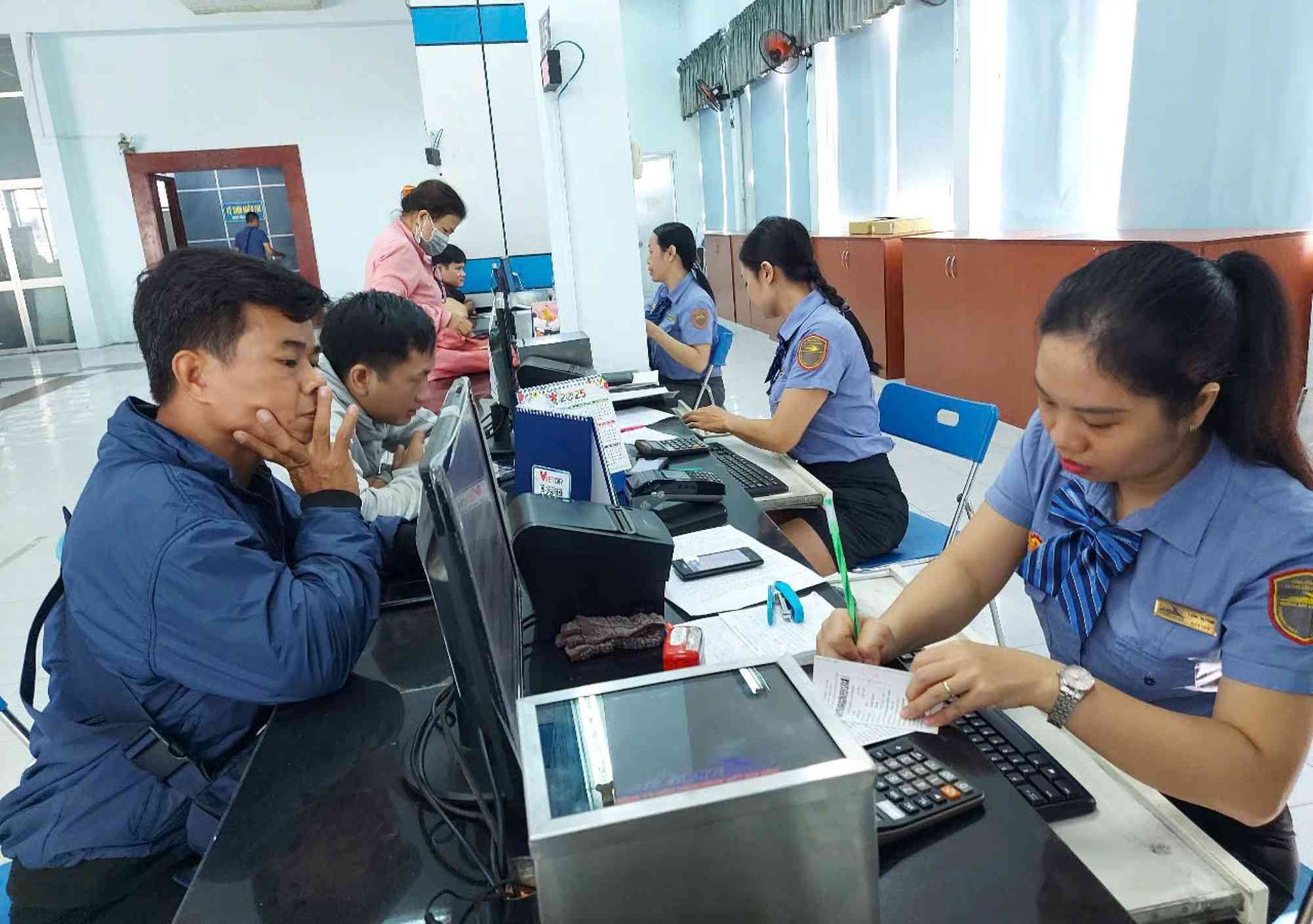 Passengers buy train tickets at Saigon Station. Photo: Minh Quan