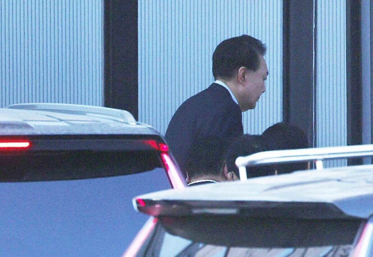 South Korean President Yoon Suk Yeol arrives at the CIO headquarters on January 15. Photo: AFP