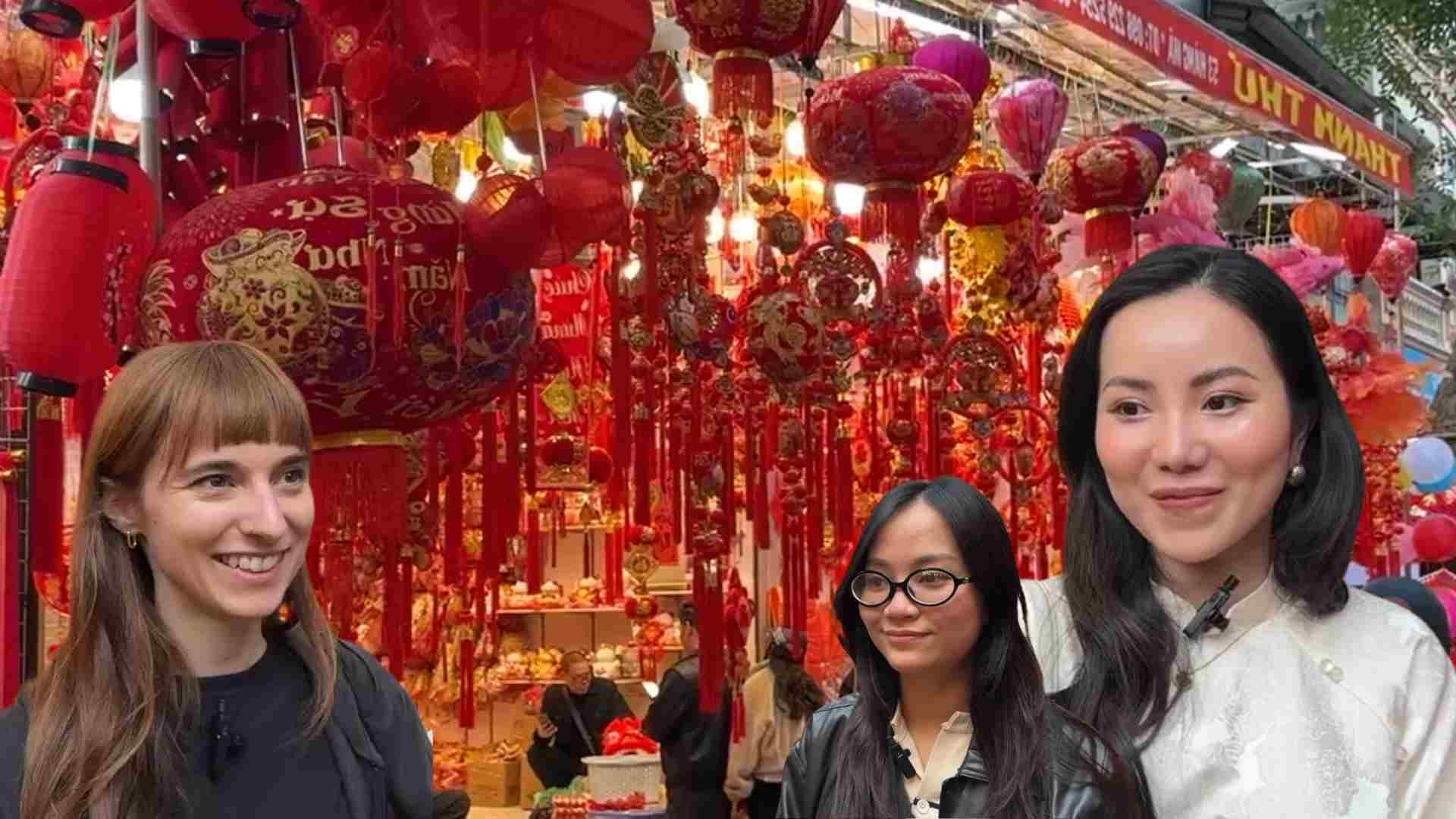 Hang Ma Street is crowded with tourists taking pictures and shopping for Lunar New Year