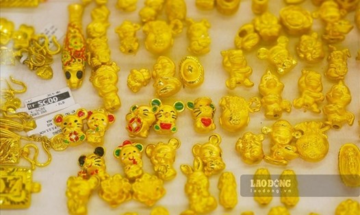 Một số chuyên gia dự báo, với vai trò là tài sản trú ẩn an toàn, vàng có thể đạt mốc 4.000 USD/ounce vào năm 2025. Ảnh minh họa: Phan Anh