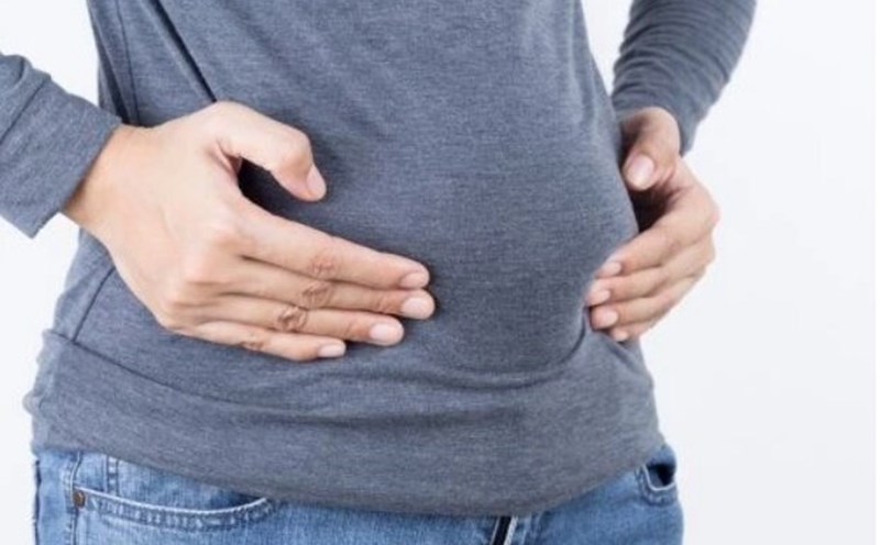 One of the most common signs of consuming too much fiber is bloating and gas. Photo: Shutterstock.