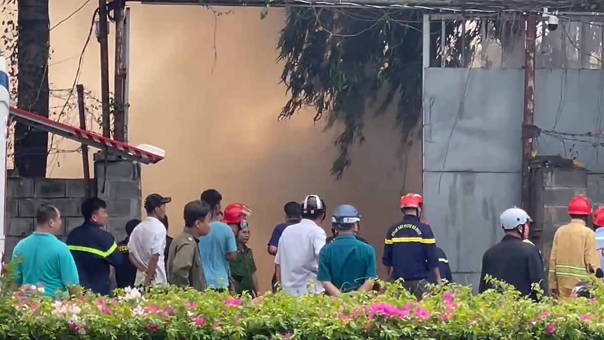 Scrap yard fire, threatening to spread to motorbike warehouse.