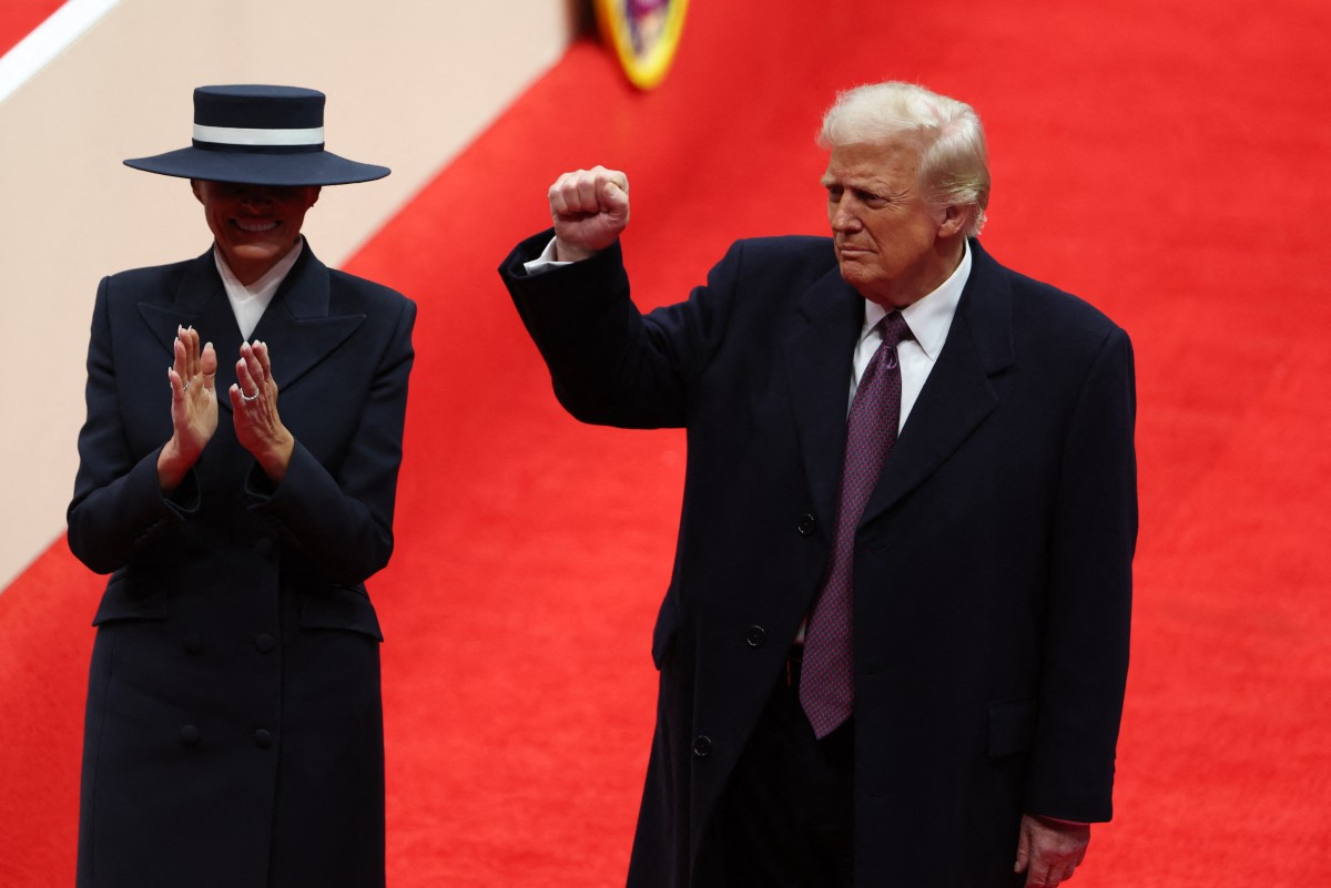 First Lady Melania Trump and US President Donald Trump arrive for the indoor inaugural parade at Capital One Arena. Photo: AFP