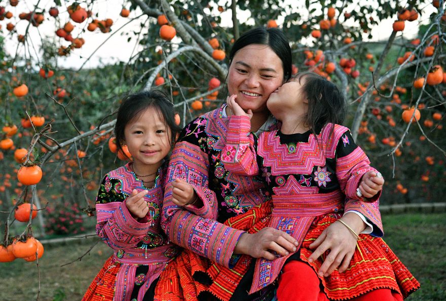 Happy family in the rose garden.