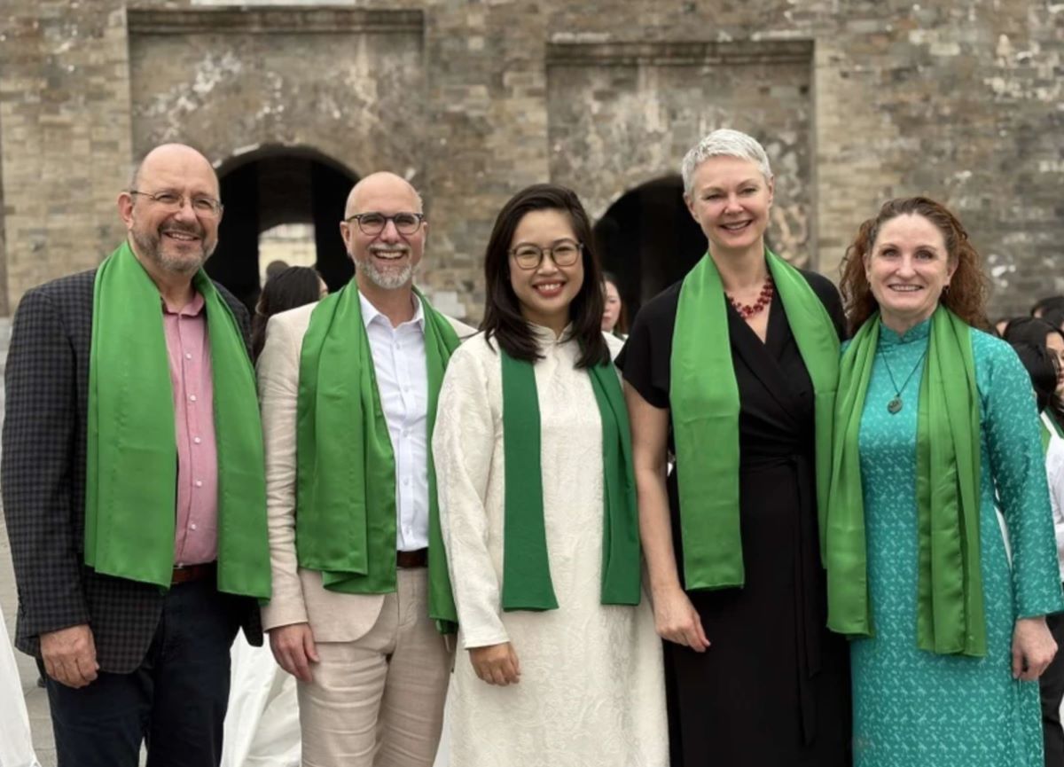 G4 Ambassadors and conductor Hai Yen (middle) of the Green Wind Choir participate in the MV celebrating the Lunar New Year of the Snake. Photo: Embassy