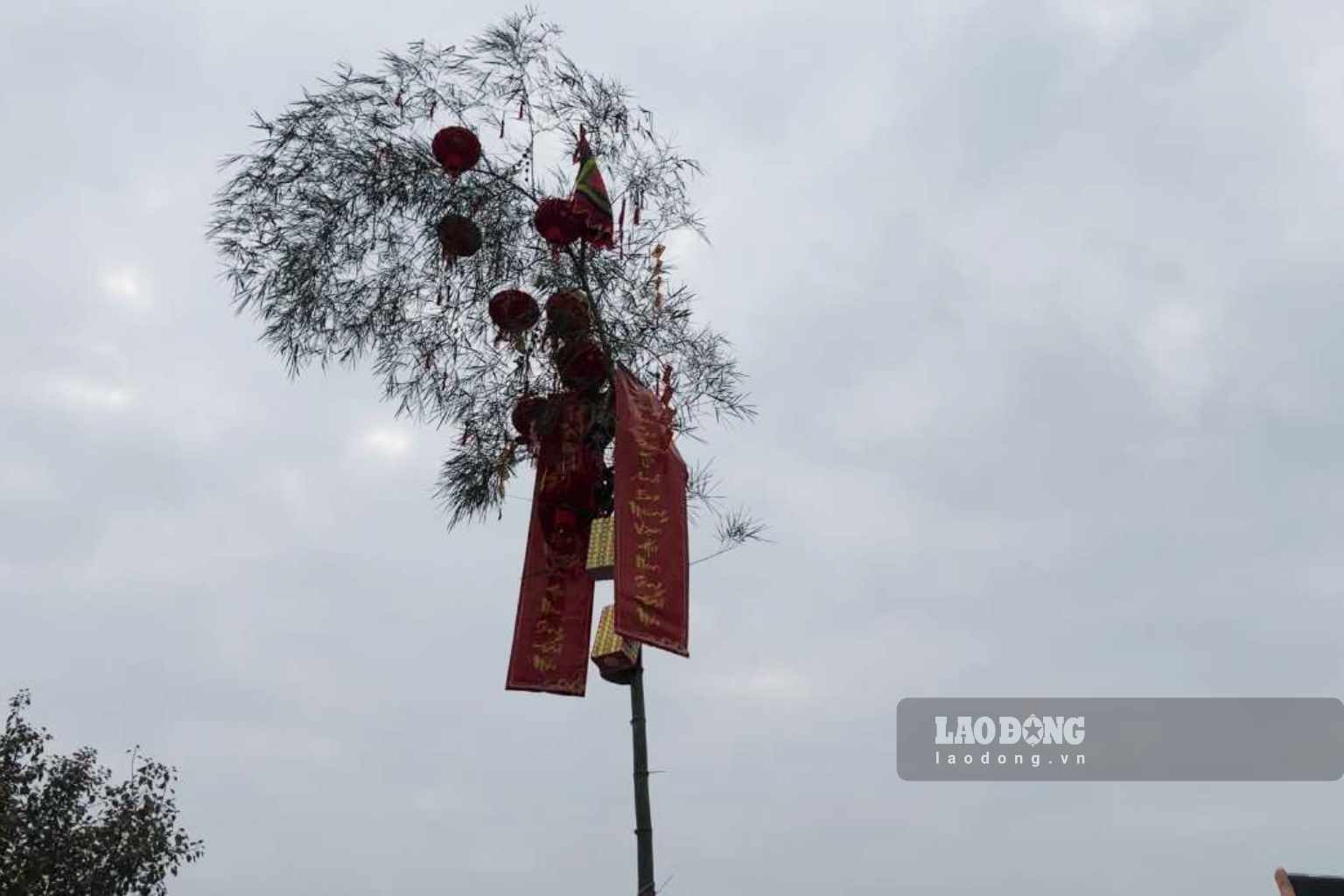 The Tet pole is one of the symbols of the Lunar New Year. Photo: Nguyen Dat