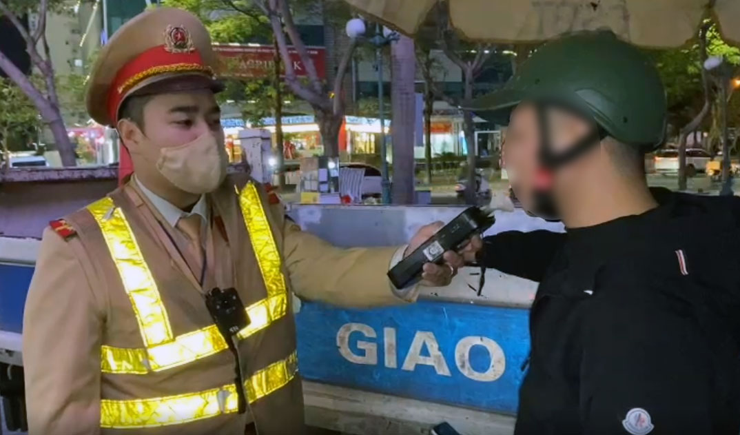 Traffic police check alcohol levels during Tet. Photo: Tien Trach
