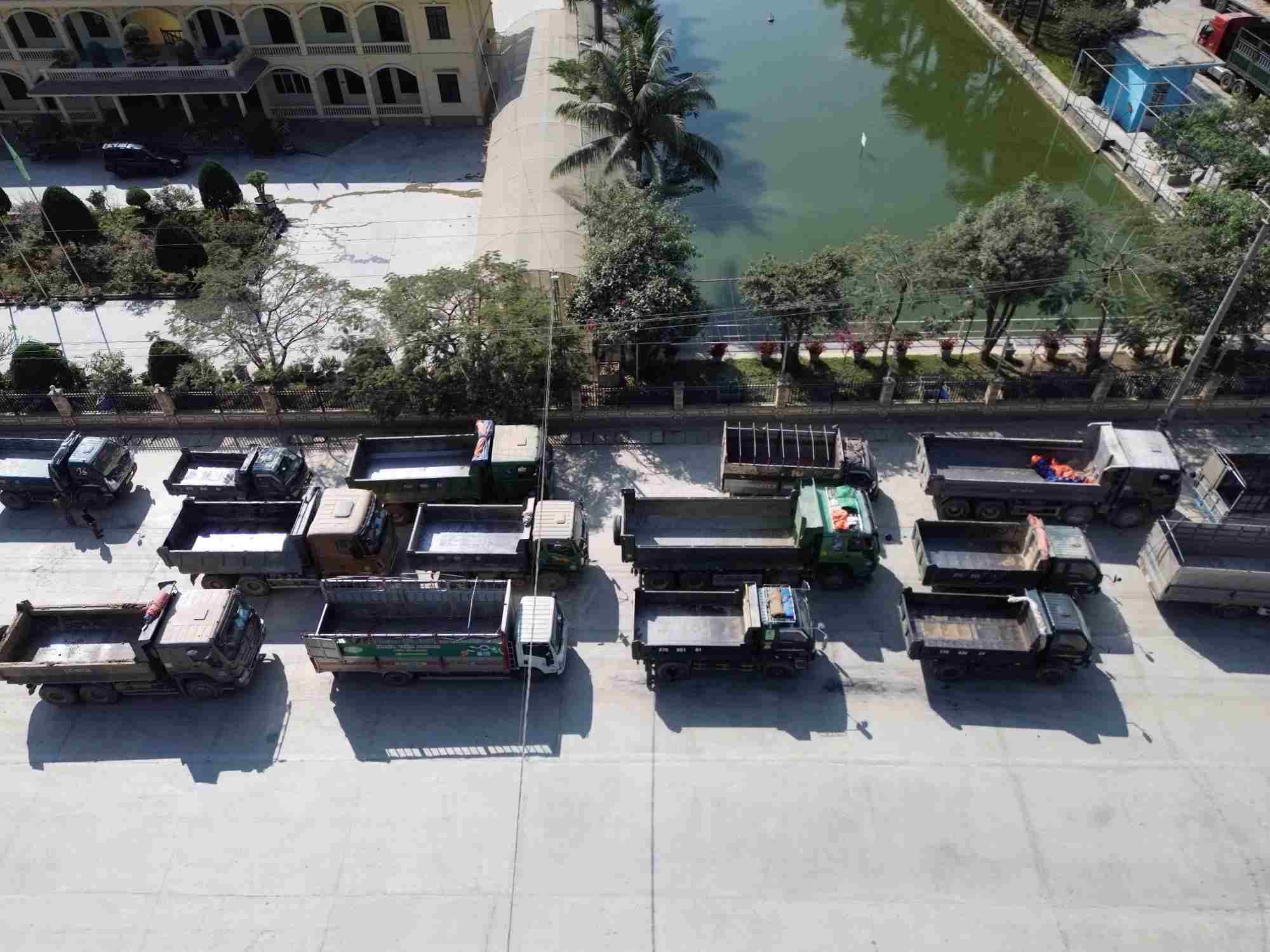 Trucks lined up waiting to pick up goods at Dien Bien Cement Factory. Photo: Quang Dat