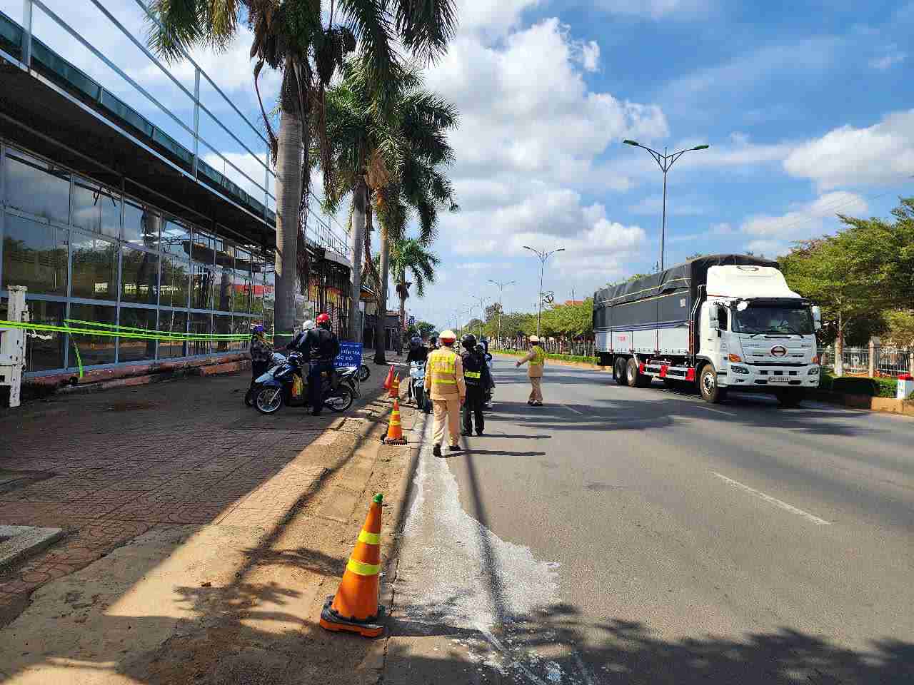 Traffic police check motorbikes during Tet At Ty. Photo: Bao Trung
