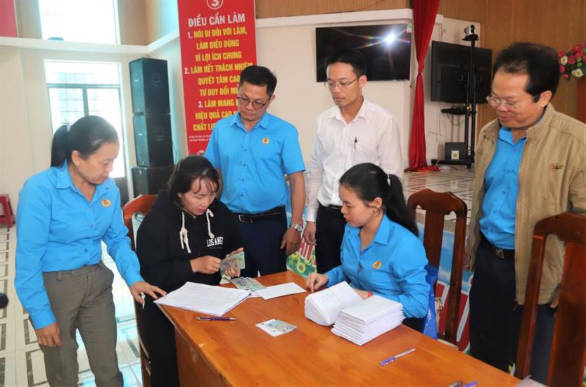 Workers were excited to receive part of their owed wages. Photo: Lam Hong