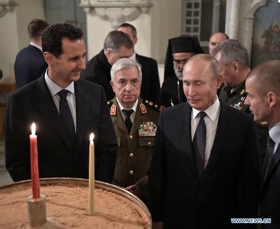 Tong thong Syria Bashar al-Assad va Tong thong Nga Vladimir Putin tham mot nha tho Chinh thong giao o Damascus, Syria, ngay 7.1.2020. Anh: Xinhua