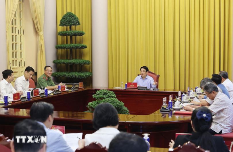 Chu tich nuoc Luong Cuong chu tri buoi lam viec. Anh: TTXVN