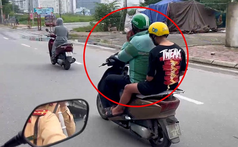 Hanoi Traffic Police patrol a special motorbike, recording a driver using a phone while driving