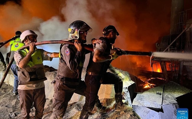 People are trying to extinguish a fire at a cement factory in Ansar, southern Lebanon, after an Israeli airstrike on October 16. Photo: Xinhua