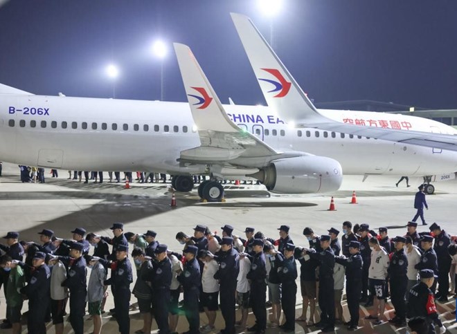 taken the online fraud suspects home at Phnom Penh International Airport, Cambodia, on April 13, 2025. Photo: Xinhua