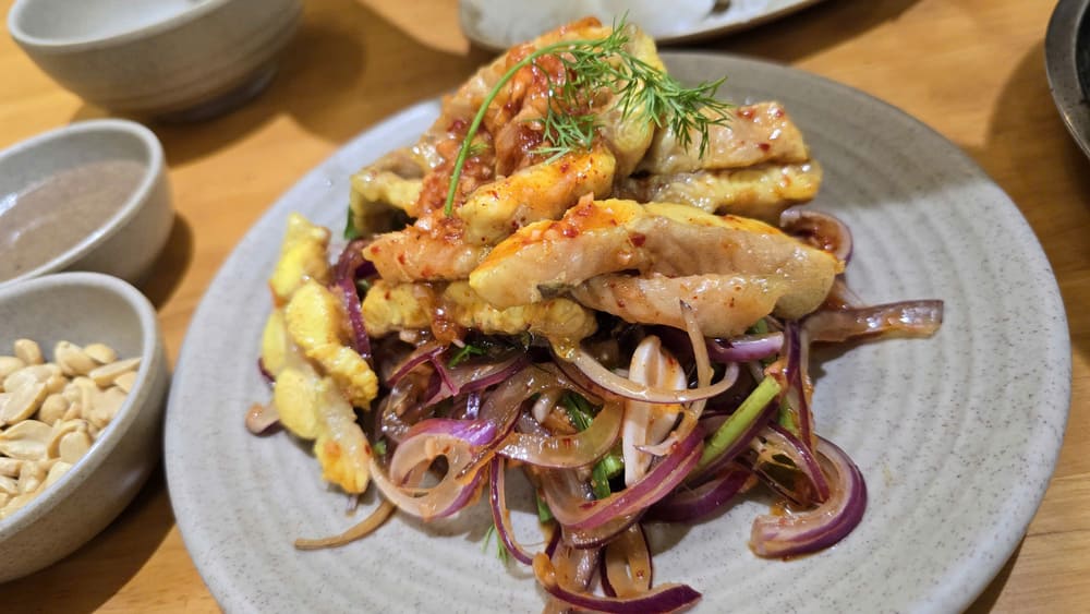 Spicy and sour catfish salad can be easily made at home with a simple recipe. Photo: Tuan Dat
