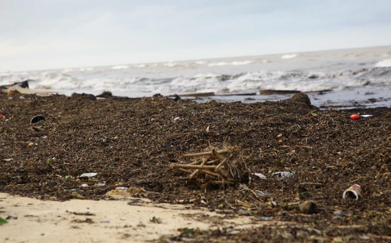 Garbage overflows Nhat Le beach after storm No. 10. Photo: Cong Sang