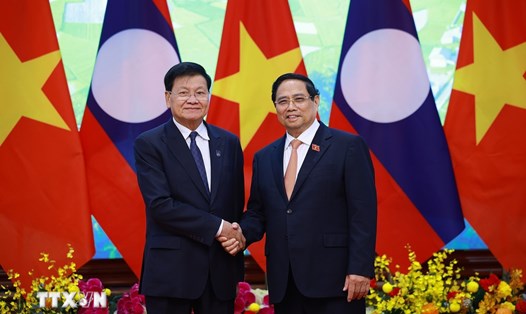 Tổng Bí thư, Chủ tịch nước Lào Thongloun Sisoulith bày tỏ vui mừng khi sang dự lễ mở ký Công ước Hà Nội. Ảnh: TTXVN