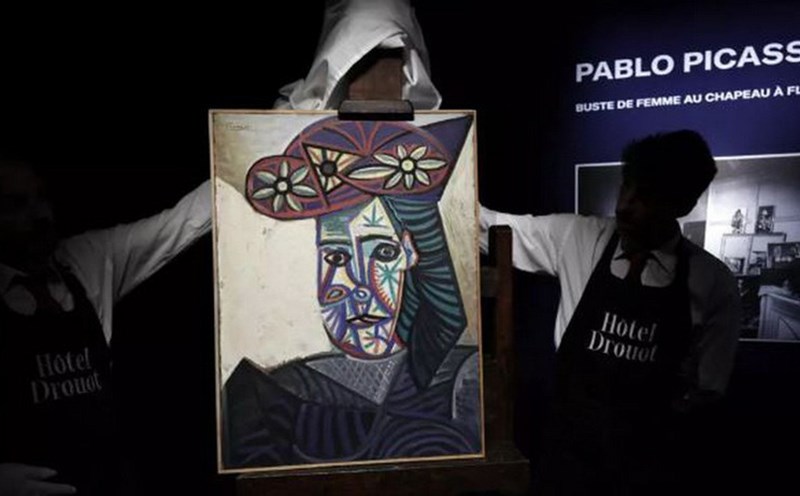 The painting is called " burst of a Woman with a Flower Hat (Dora Maar)" by famous artist Picasso. Photo: VNA/AFP